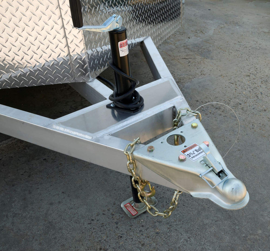 Front A-frame tongue of a tandem-axle enclosed cargo trailer showing the frame structure. 