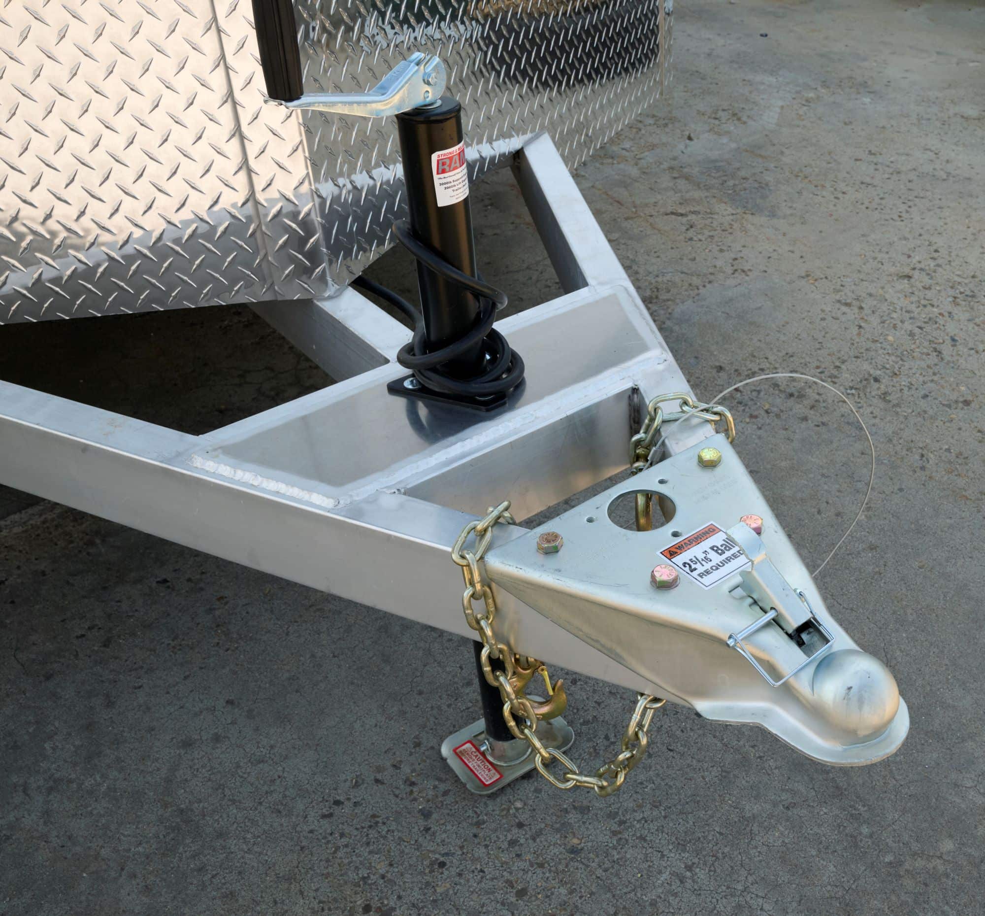 Front A-frame tongue of a tandem-axle enclosed cargo trailer showing the frame structure. 