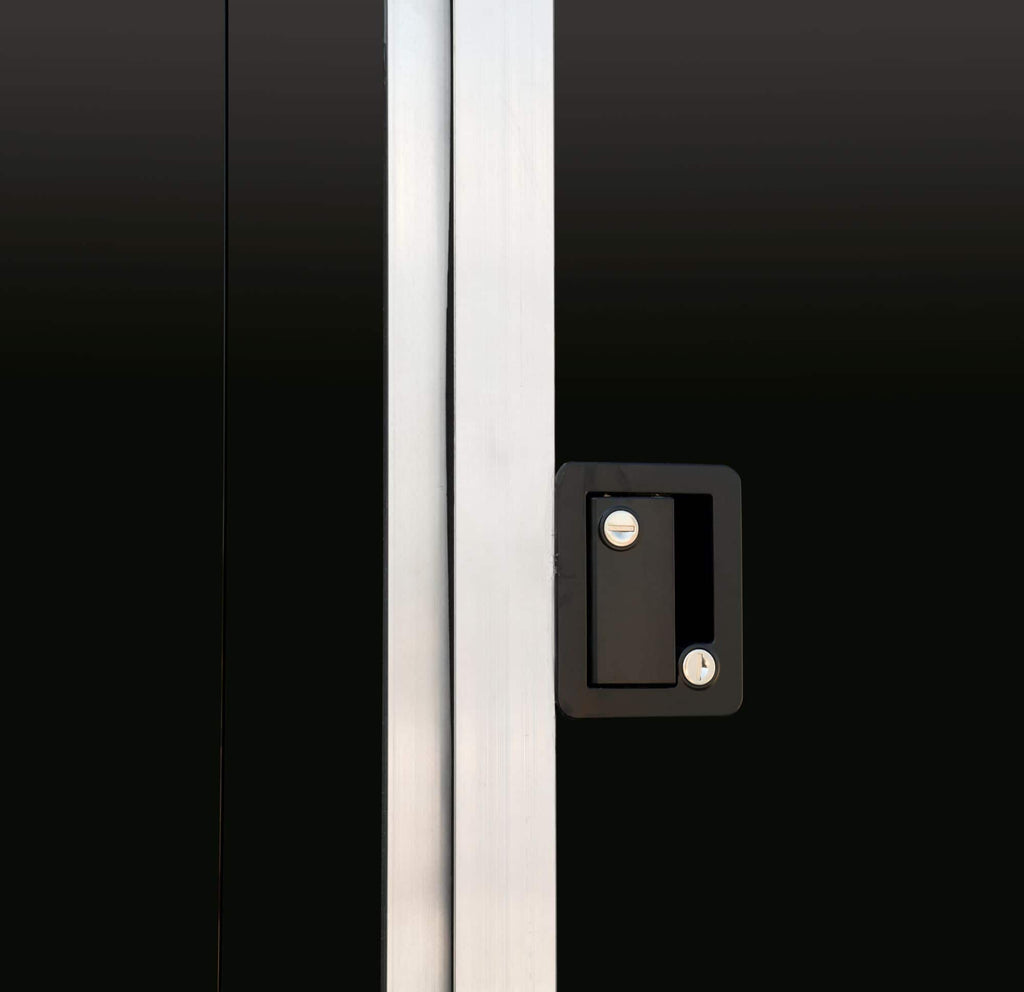 Black tandem-axle enclosed cargo trailer close-up door shot.