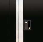 Black tandem-axle enclosed cargo trailer close-up door shot.