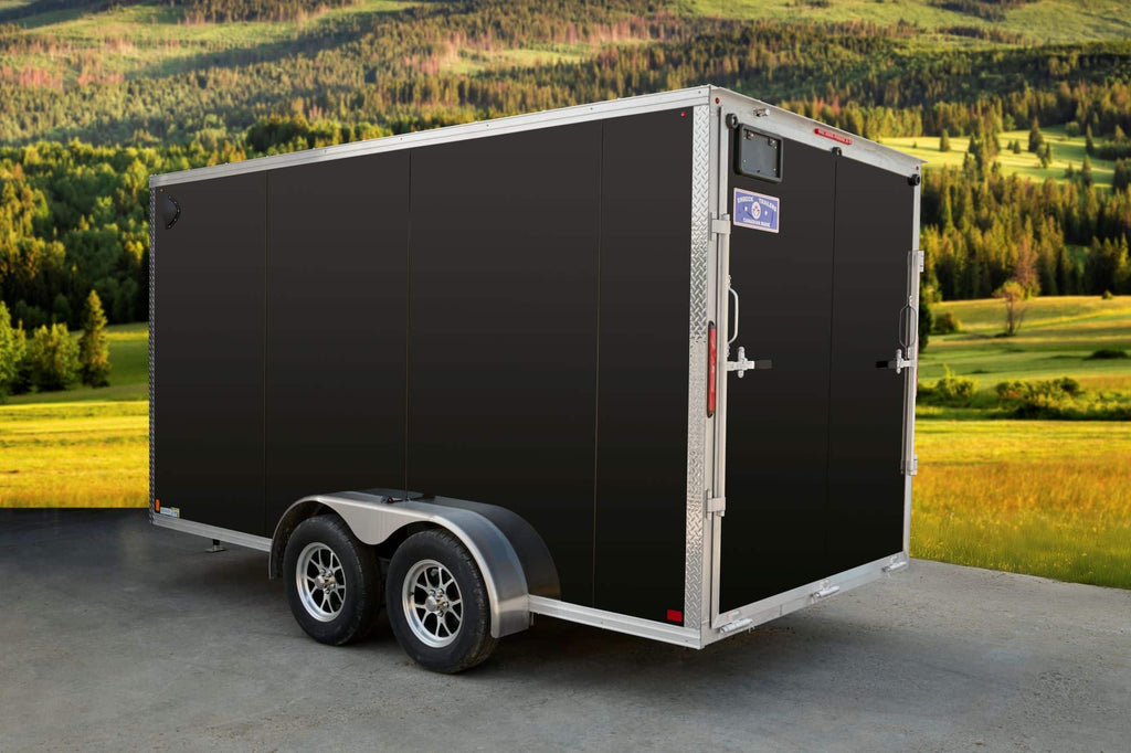 Black tandem-axle enclosed cargo trailer side & back view.