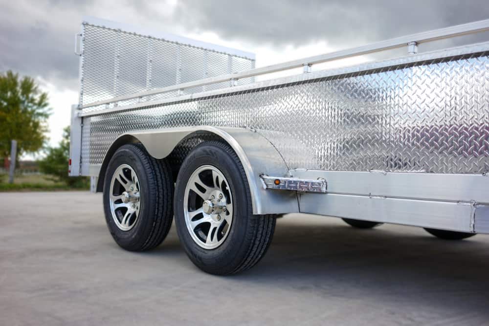 Tandem axle landscape utility trailer viewed from the front right side.