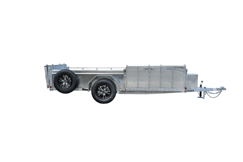 Silver tandem axle utility trailer with diamond-plate sides, open fold-down rear ramp, side-mounted spare tire, and black wheels.