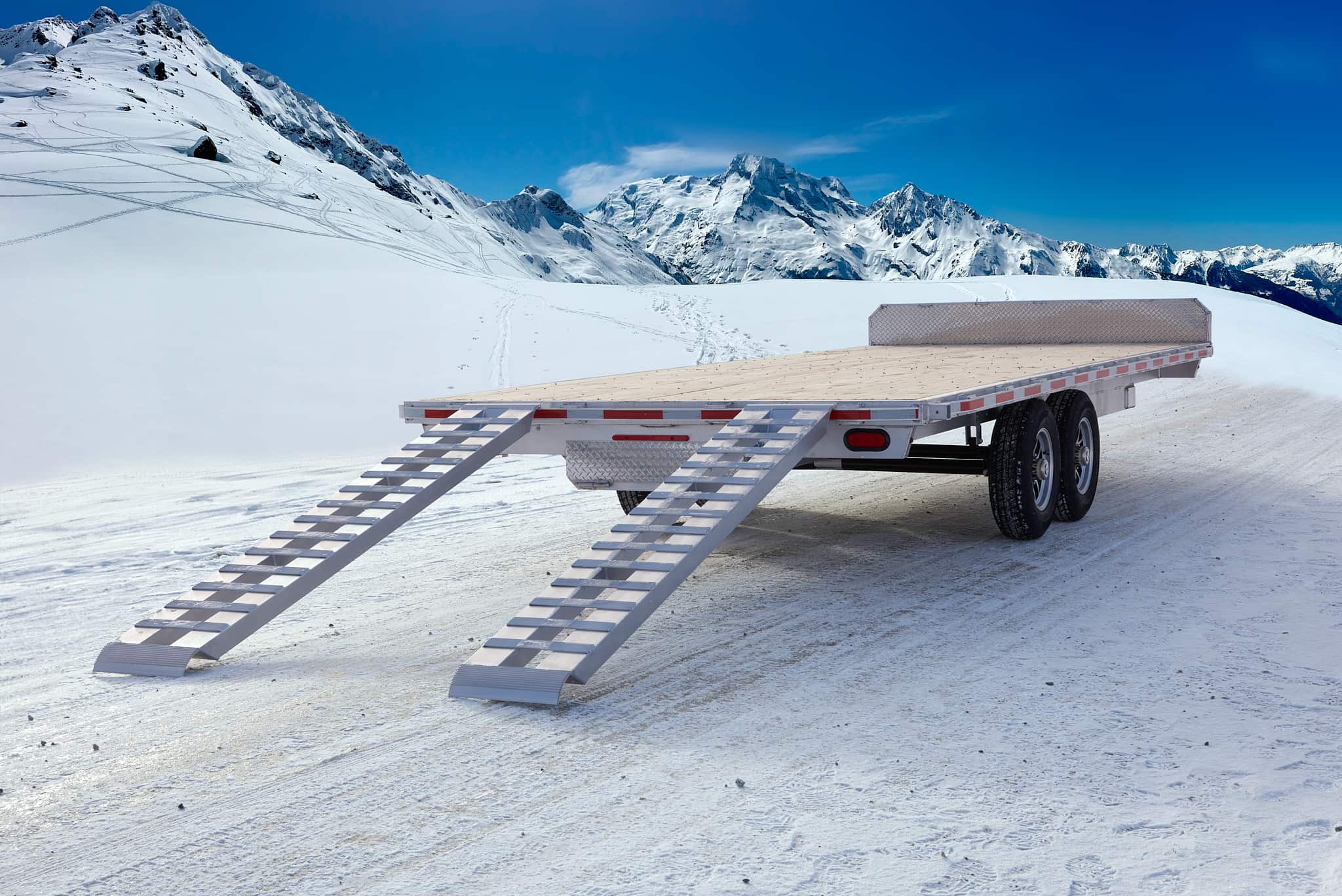 Tandem deckover wheel-under trailer viewed from the back right side.